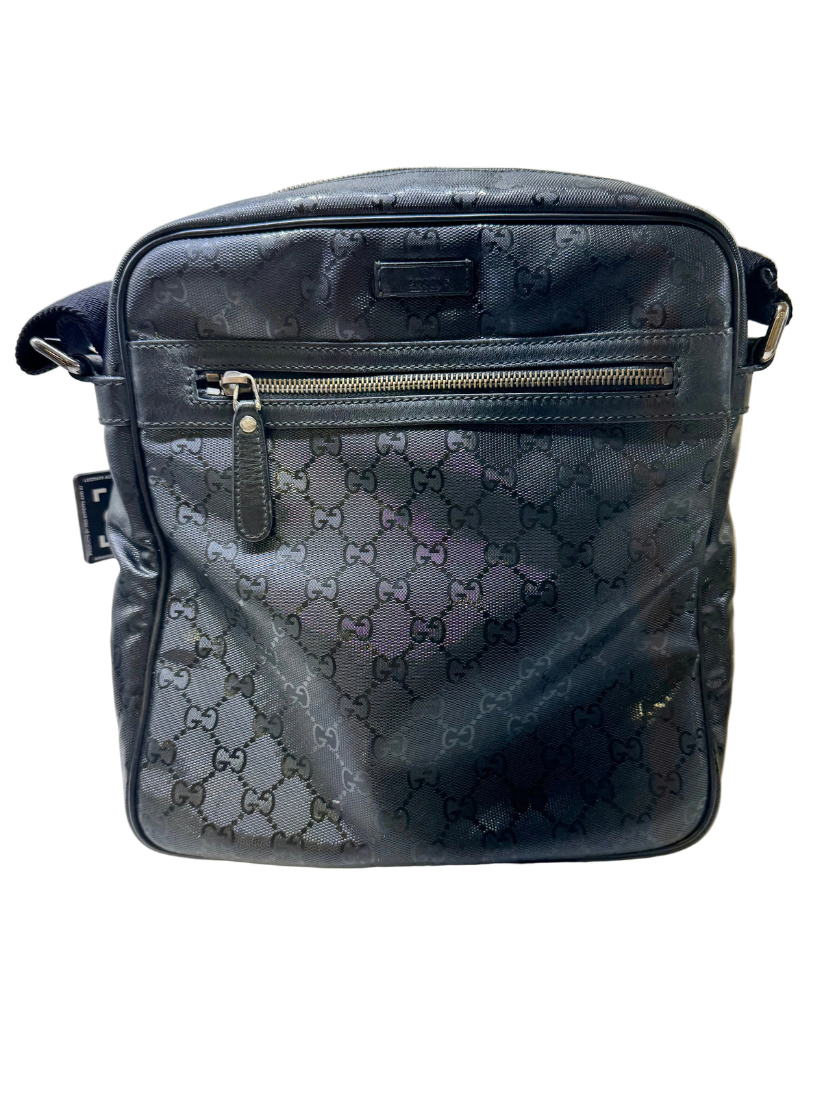 Gucci GG Imprime messenger bag in black, featuring a coated canvas body with tonal monogram detailing and adjustable strap