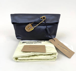 Burberry Grey Silk Satin Clutch featuring a large gold-tone safety pin embellished with crystals