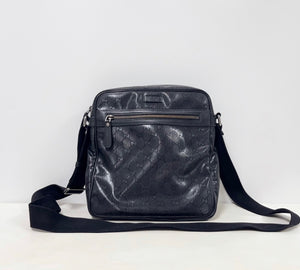 Gucci GG Imprime messenger bag in black, featuring a coated canvas body with tonal monogram detailing and adjustable strap