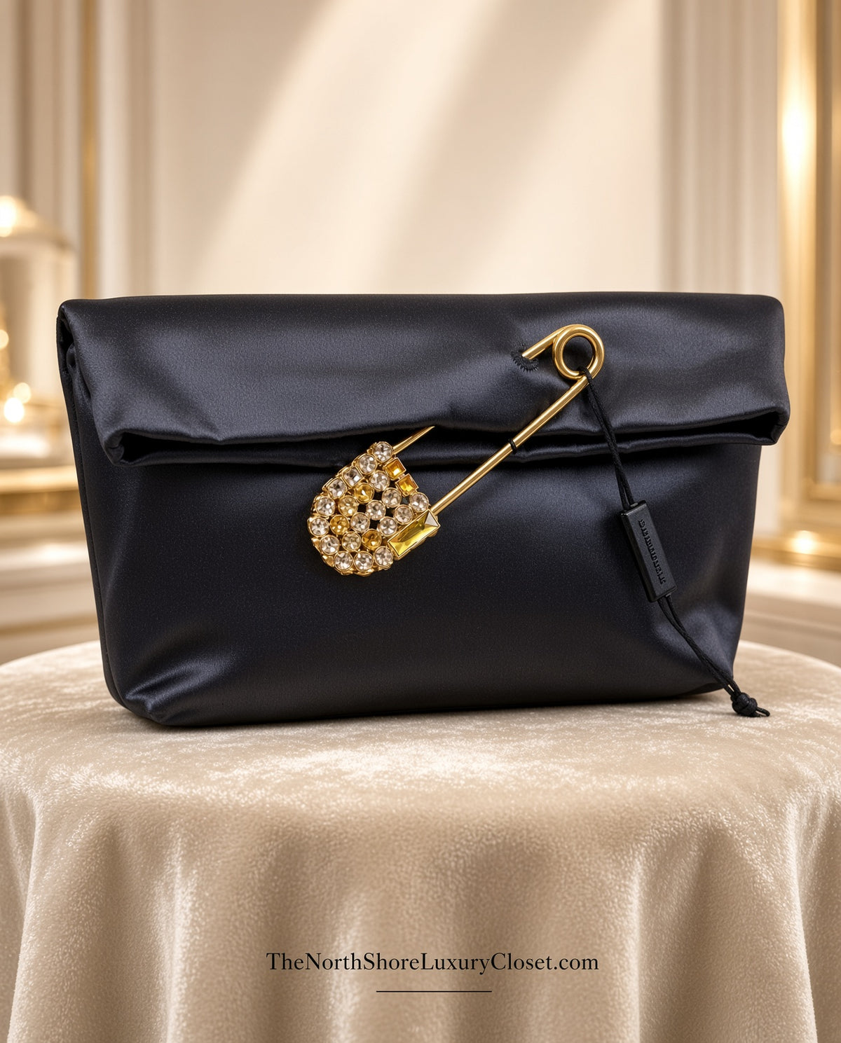 Burberry Grey Silk Satin Clutch featuring a large gold-tone safety pin embellished with crystals