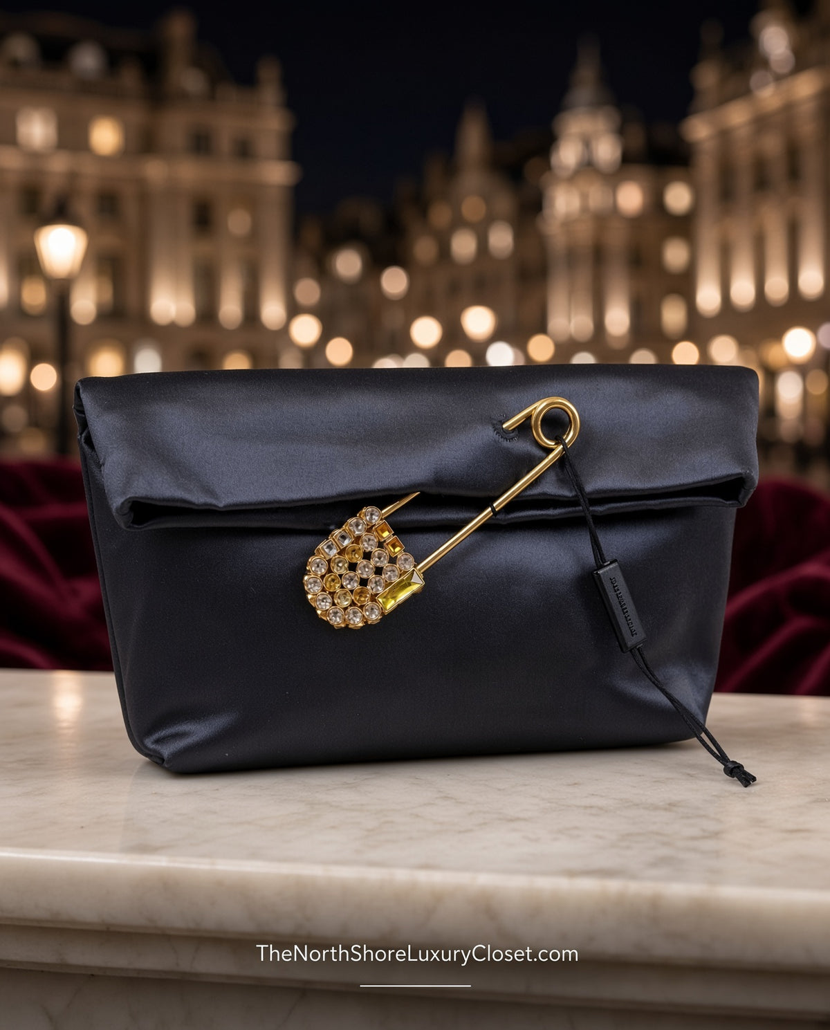 Burberry Grey Silk Satin Clutch featuring a large gold-tone safety pin embellished with crystals